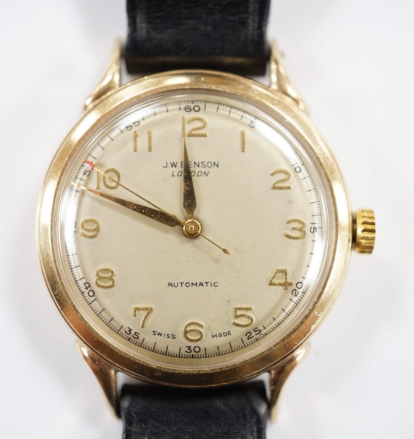 A gentleman's early 1950's 9ct gold J.W. Benson automatic wrist watch, case diameter 34mm, on associated leather strap, no buckle.